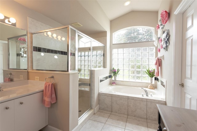 7 Lewis Shire Way, Palm Coast, FL 32137 - bathroom with vanity, a bath, tile patterned floors, a shower stall, and lofted ceiling