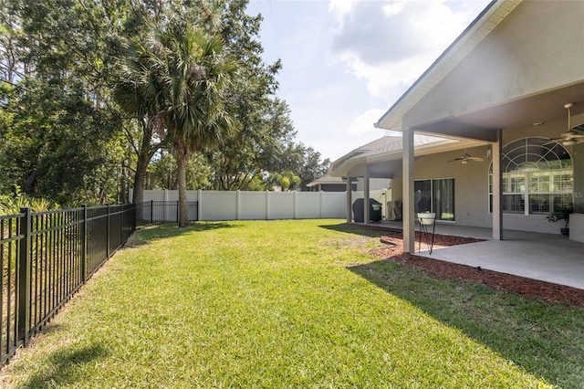 7 Lewis Shire Way, Palm Coast, FL 32137 - fenced backyard with ceiling fan and a patio area