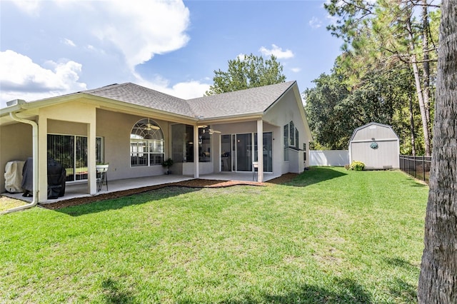 7 Lewis Shire Way, Palm Coast, FL 32137 - rear view of house with a patio, a storage unit, a fenced backyard, stucco siding, and roof with shingles