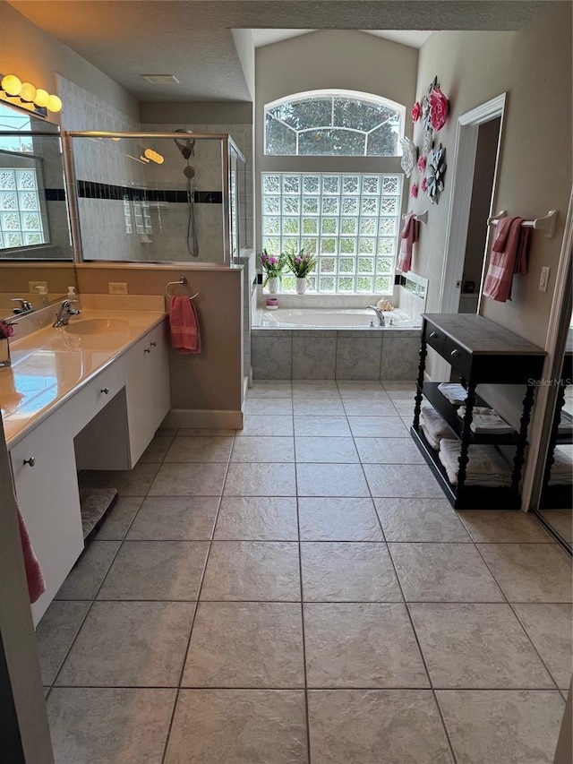 7 Lewis Shire Way, Palm Coast, FL 32137 - bathroom featuring vanity, a garden tub, tile patterned floors, and a stall shower