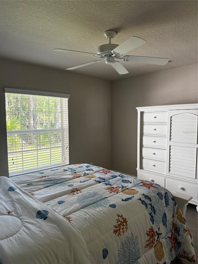 7 Lewis Shire Way, Palm Coast, FL 32137 - bedroom featuring a textured ceiling and ceiling fan
