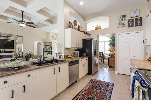 20 Long Pl, Palm Coast, FL 32137 - kitchen with stainless steel appliances, a high ceiling, ceiling fan, coffered ceiling, and white cabinets