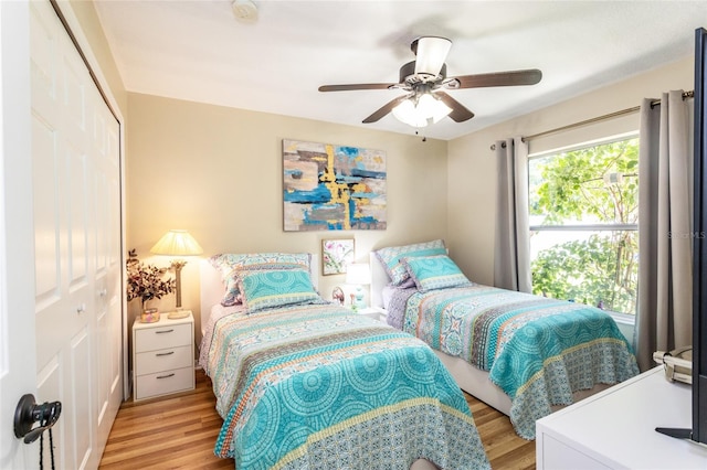 20 Long Pl, Palm Coast, FL 32137 - bedroom with a closet, light wood finished floors, and ceiling fan