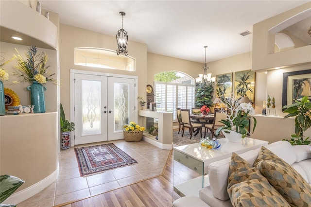 20 Long Pl, Palm Coast, FL 32137 - tiled foyer entrance with a chandelier and french doors