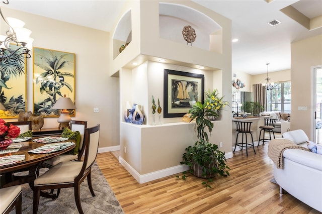 20 Long Pl, Palm Coast, FL 32137 - dining room with a chandelier, light wood-style floors, and recessed lighting