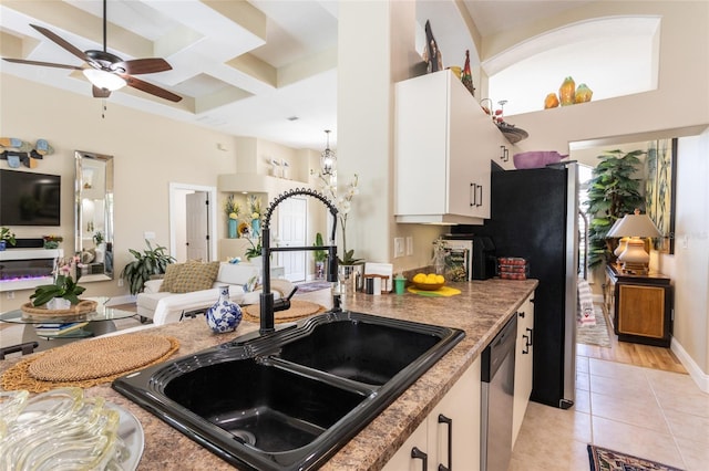 20 Long Pl, Palm Coast, FL 32137 - kitchen with coffered ceiling, stainless steel dishwasher, light tile patterned flooring, white cabinets, and a ceiling fan