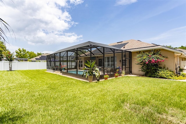 20 Long Pl, Palm Coast, FL 32137 - rear view of house with stucco siding, a patio area, and glass enclosure