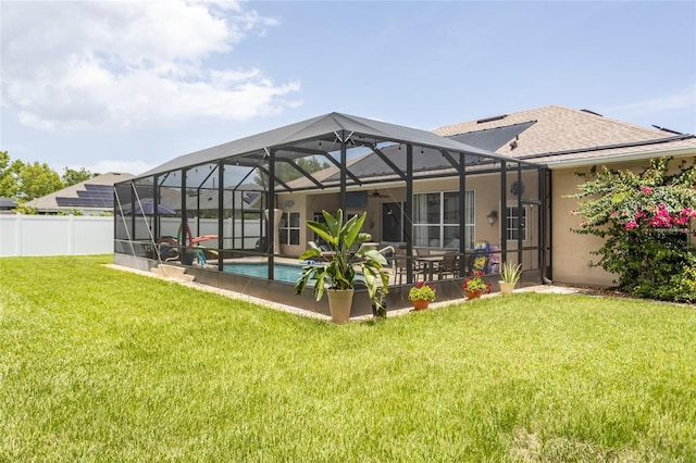 20 Long Pl, Palm Coast, FL 32137 - back of house with a patio, a shingled roof, and glass enclosure