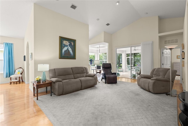 143 W Waterside Pkwy, Palm Coast, FL 32137 - living room featuring high vaulted ceiling, light wood-type flooring, and arched walkways