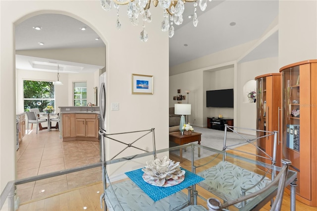 143 W Waterside Pkwy, Palm Coast, FL 32137 - dining space featuring arched walkways, vaulted ceiling, light tile patterned floors, and recessed lighting