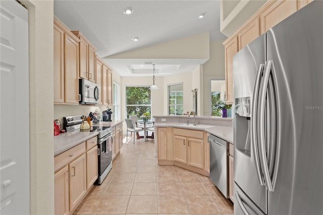 143 W Waterside Pkwy, Palm Coast, FL 32137 - kitchen featuring stainless steel appliances, light brown cabinetry, a peninsula, light countertops, and recessed lighting