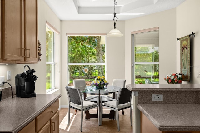 143 W Waterside Pkwy, Palm Coast, FL 32137 - dining area featuring a tray ceiling and light tile patterned floors