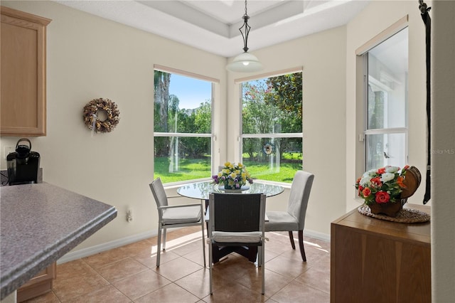 143 W Waterside Pkwy, Palm Coast, FL 32137 - dining room with light tile patterned flooring and a tray ceiling