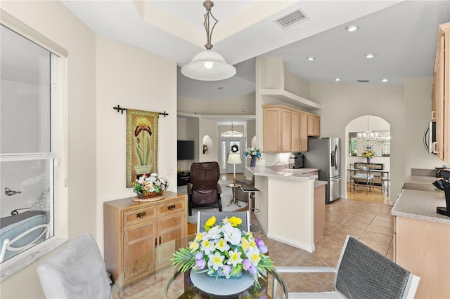 143 W Waterside Pkwy, Palm Coast, FL 32137 - kitchen with light brown cabinetry, appliances with stainless steel finishes, light countertops, a chandelier, and recessed lighting