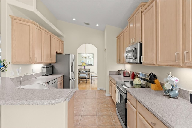 143 W Waterside Pkwy, Palm Coast, FL 32137 - kitchen featuring appliances with stainless steel finishes, light brown cabinets, a chandelier, light countertops, and recessed lighting