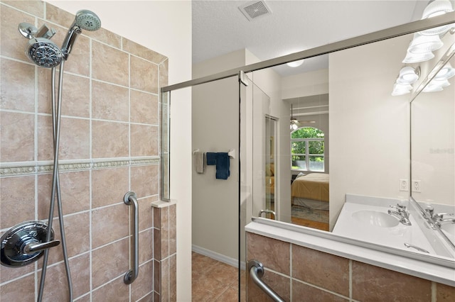 143 W Waterside Pkwy, Palm Coast, FL 32137 - ensuite bathroom featuring a stall shower, vanity, and tile patterned floors