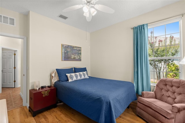 143 W Waterside Pkwy, Palm Coast, FL 32137 - bedroom with light wood-style floors and a ceiling fan