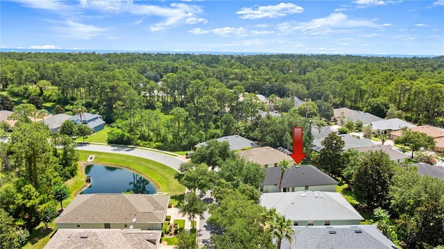 143 W Waterside Pkwy, Palm Coast, FL 32137 - aerial perspective of suburban area featuring a heavily wooded area and a nearby body of water