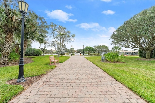 143 W Waterside Pkwy, Palm Coast, FL 32137 - view of property's community featuring a lawn and decorative driveway