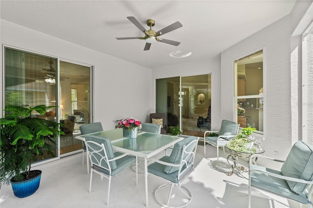 143 W Waterside Pkwy, Palm Coast, FL 32137 - sunroom with a ceiling fan and outdoor dining space