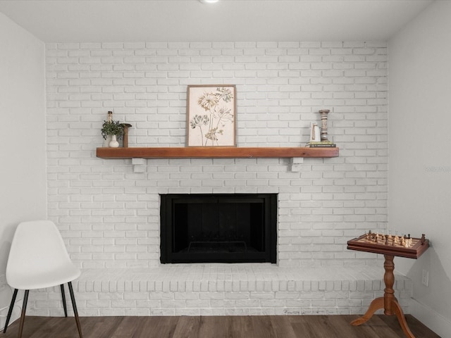 506 Dorset Cir S, Daytona, FL 32119 - detailed view of wood finished floors and a brick fireplace