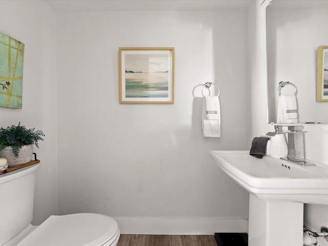 506 Dorset Cir S, Daytona, FL 32119 - bathroom with toilet and wood finished floors