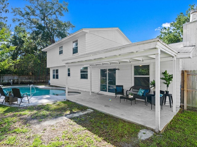506 Dorset Cir S, Daytona, FL 32119 - rear view of house with a patio area, an outdoor living space, and a fenced backyard