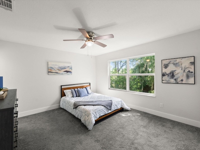 506 Dorset Cir S, Daytona, FL 32119 - carpeted bedroom featuring baseboards and a ceiling fan