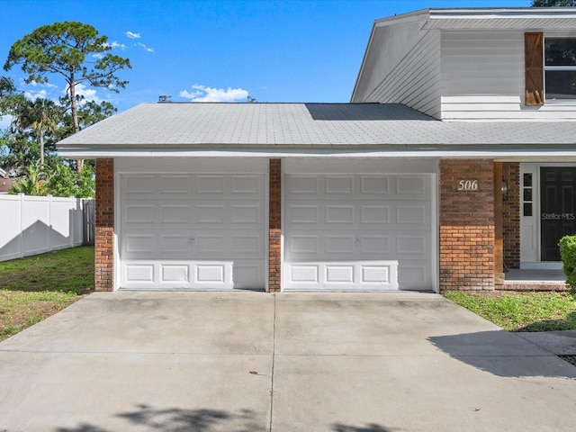 506 Dorset Cir S, Daytona, FL 32119 - garage with concrete driveway