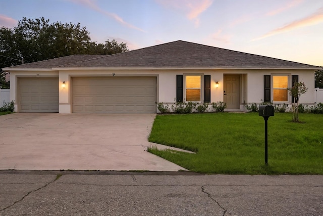 17 Roxbury Ln, Palm Coast, FL 32164 - ranch-style home with stucco siding, driveway, an attached garage, a lawn, and a shingled roof
