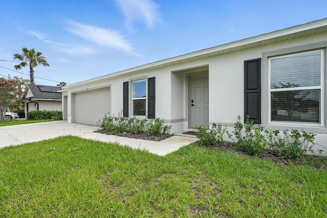 17 Roxbury Ln, Palm Coast, FL 32164 - view of front facade featuring stucco siding, concrete driveway, a garage, and a front lawn