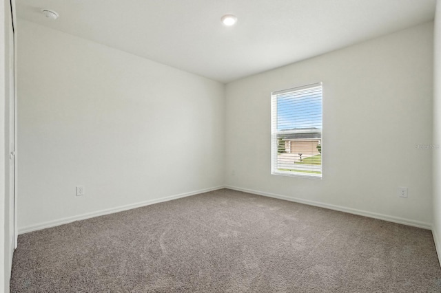 17 Roxbury Ln, Palm Coast, FL 32164 - empty room with carpet and a smoke detector