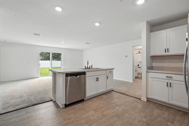 17 Roxbury Ln, Palm Coast, FL 32164 - kitchen featuring stainless steel dishwasher, white cabinets, light countertops, and recessed lighting