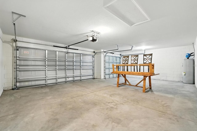17 Roxbury Ln, Palm Coast, FL 32164 - garage featuring electric water heater, concrete block wall, and a garage door opener