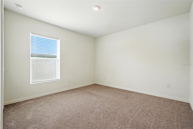 17 Roxbury Ln, Palm Coast, FL 32164 - spare room featuring carpet floors and a smoke detector