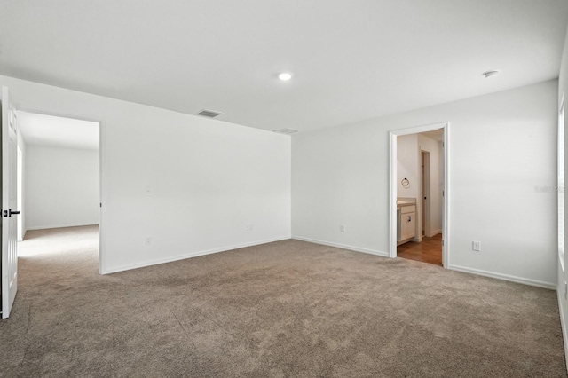 17 Roxbury Ln, Palm Coast, FL 32164 - carpeted empty room with baseboards and recessed lighting