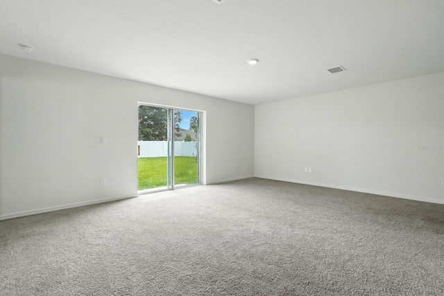 17 Roxbury Ln, Palm Coast, FL 32164 - empty room with carpet and a smoke detector