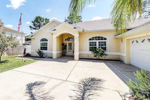 43 White Dove Ln, Palm Coast, FL 32164 - single story home with stucco siding, concrete driveway, a garage, and a shingled roof