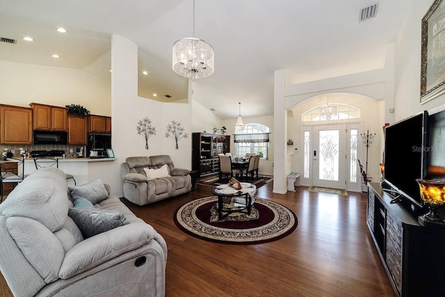 43 White Dove Ln, Palm Coast, FL 32164 - living room featuring a chandelier, wood finished floors, high vaulted ceiling, and recessed lighting
