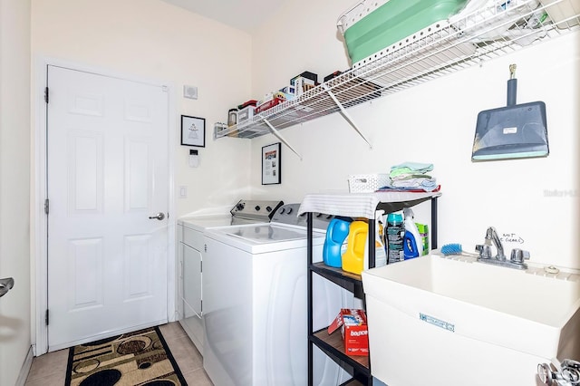 43 White Dove Ln, Palm Coast, FL 32164 - laundry room with washing machine and dryer and light tile patterned floors