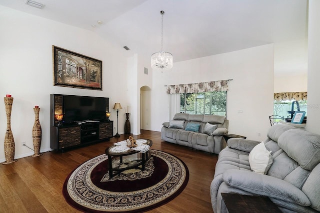 43 White Dove Ln, Palm Coast, FL 32164 - living room featuring arched walkways, dark wood-style flooring, a chandelier, healthy amount of natural light, and high vaulted ceiling