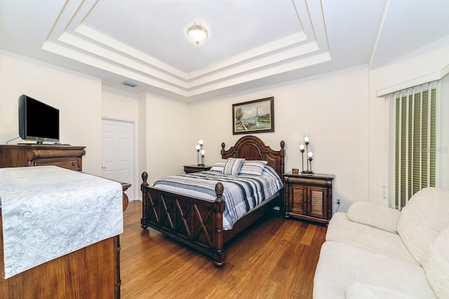 43 White Dove Ln, Palm Coast, FL 32164 - bedroom with a tray ceiling and wood finished floors