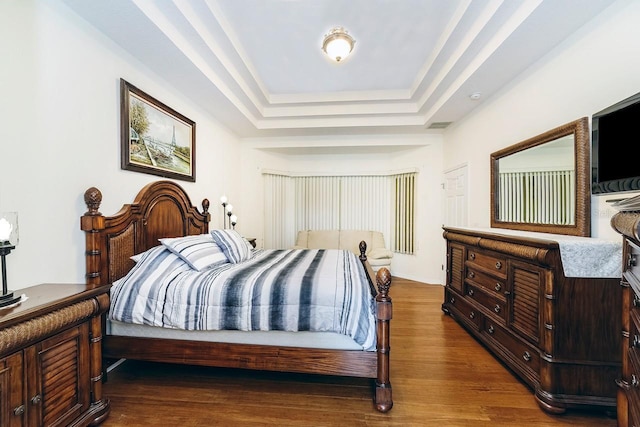 43 White Dove Ln, Palm Coast, FL 32164 - bedroom featuring dark wood-style floors and a tray ceiling