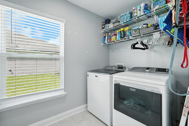 47 Lumberjack Trl, Palm Coast, FL 32137 - laundry room with washer and dryer, healthy amount of natural light, and light tile patterned flooring