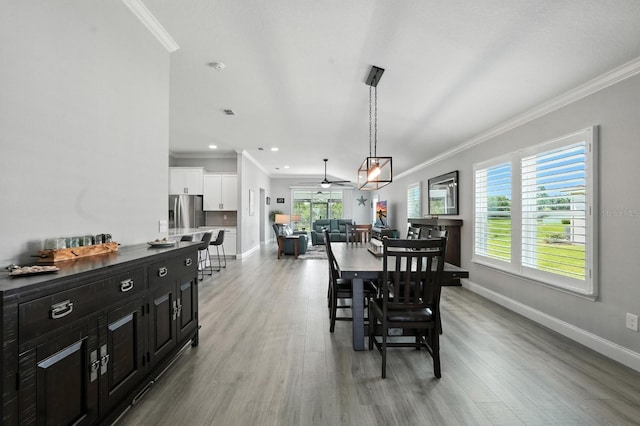47 Lumberjack Trl, Palm Coast, FL 32137 - dining space with ornamental molding, light wood-style floors, plenty of natural light, a ceiling fan, and recessed lighting