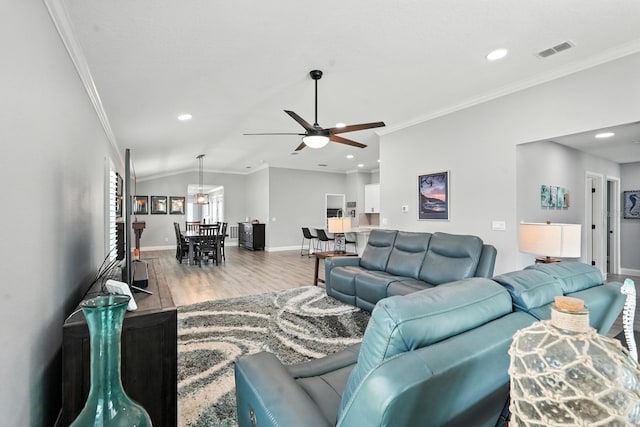 47 Lumberjack Trl, Palm Coast, FL 32137 - living room with ornamental molding, a ceiling fan, wood finished floors, recessed lighting, and vaulted ceiling