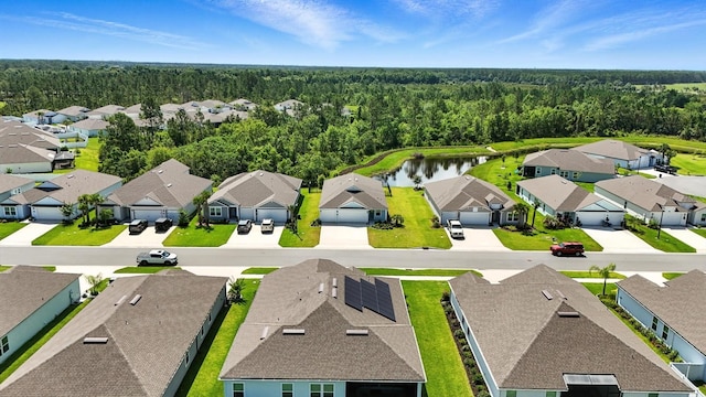 47 Lumberjack Trl, Palm Coast, FL 32137 - aerial perspective of suburban area featuring a heavily wooded area and a large body of water