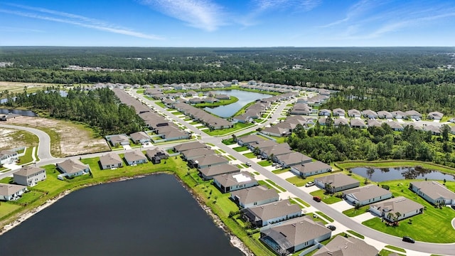 47 Lumberjack Trl, Palm Coast, FL 32137 - aerial view of residential area featuring a nearby body of water and a forest