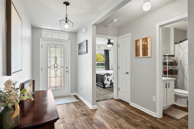 7 Grand Par Ct, Bunnell, FL 32110 - entryway featuring dark wood finished floors and a textured ceiling