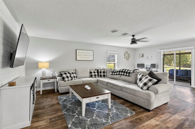 7 Grand Par Ct, Bunnell, FL 32110 - living room with dark wood-type flooring, ceiling fan, and a textured ceiling